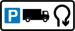 Direction to a lorry park via a U-turn at a roundabout ahead — UK road sign