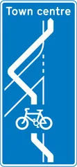 Route for pedal cycles across an entry slip road at a junction ahead — UK road sign
