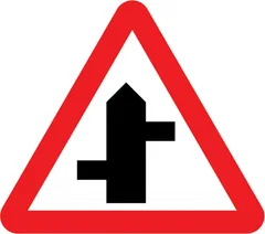 Staggered junction ahead (left/right) — UK road sign
