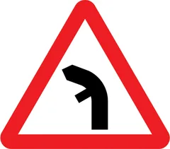 Junction on left bend ahead — UK road sign