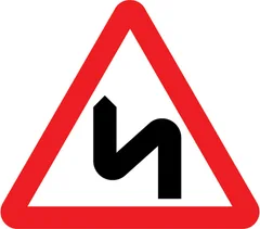 Vehicle Handling topic icon: Double bend or series of bends ahead, first to the left sign