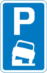 Vehicles may be parked partially on the verge or footway — UK road sign