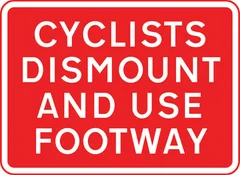 Cyclists to dismount and use the adjacent footway — UK road sign