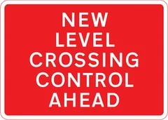New method of controlling traffic at a railway or tramway level crossing ahead — UK road sign