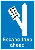 Escape lane to left for vehicles unable to stop on a steep hill — UK road sign
