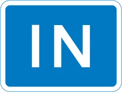 Entrance to a car park, private access road or property — UK road sign