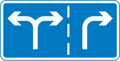 Appropriate traffic lanes for different manoeuvres at a junction ahead — UK road sign