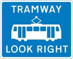 Warning for pedestrians to look out for tramway traffic approaching from the right — UK road sign